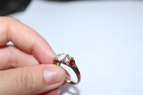 A Victorian 15ct, graduated white opal, split pearl and topaz? set half hoop ring, size O.